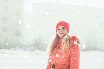 Portrait of a young woman in snow