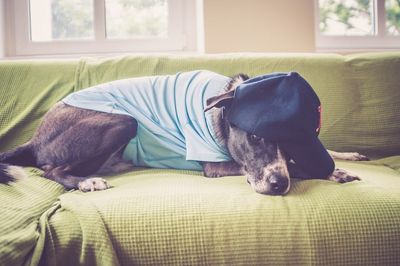 Man lying on sofa at home