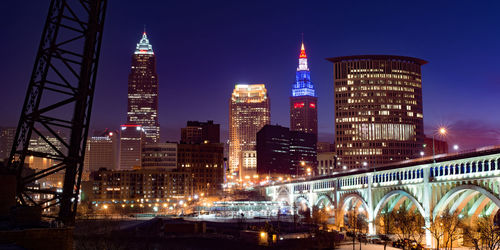 Illuminated buildings in city at night