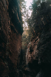 Low angle view of sunlight falling on rock