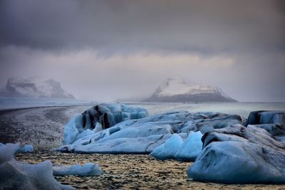 Scenic view of frozen sea against sky