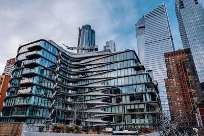 Low angle view of modern buildings against sky