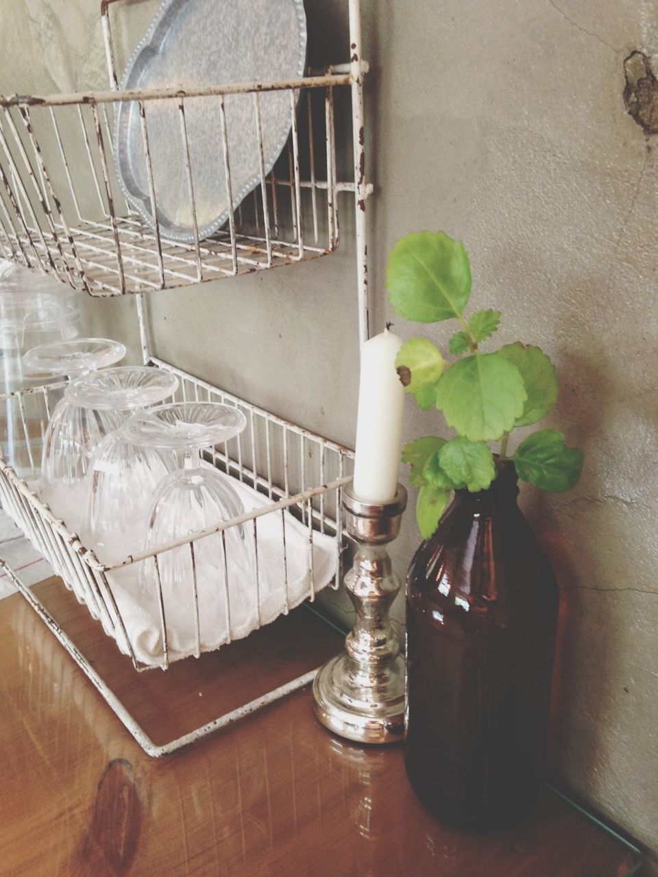 indoors, high angle view, table, chair, metal, no people, absence, wall - building feature, empty, potted plant, day, flooring, home interior, wood - material, close-up, sunlight, still life, plant, seat, built structure