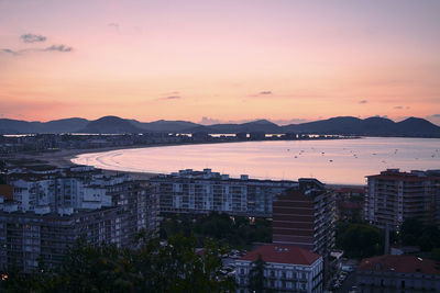 High angle view of buildings against sky during sunset