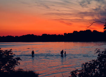 Scenic view of lake against sky during sunset