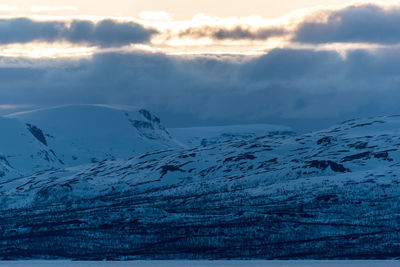 Scenic view of mountains against sky during winter