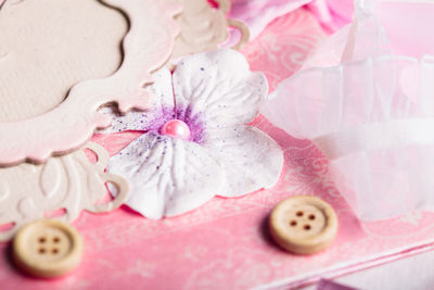 High angle view of pink petals on white floor