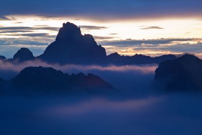 Scenic view of mountains against sky during sunset