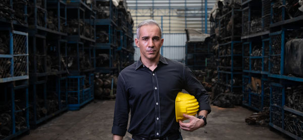 Portrait of man standing in building