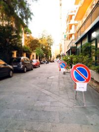 Road sign on street in city
