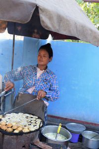 Full length of man holding ice cream