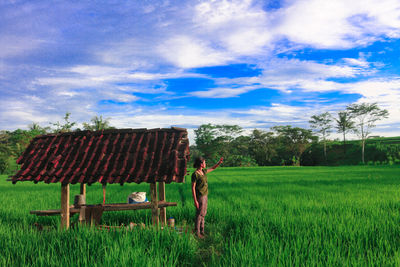 Full length of man on agricultural field against sky