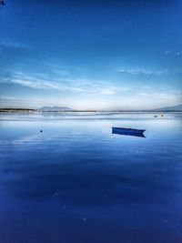 Scenic view of blue sea against sky