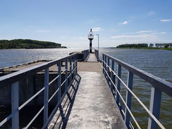 Pier over sea against sky