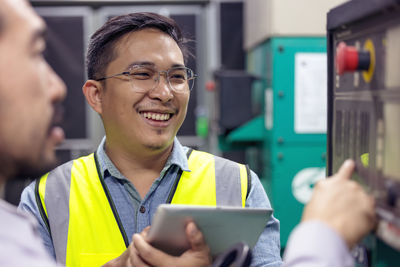 Close up hand of engineer or electrician man working check the electrical system with tablet