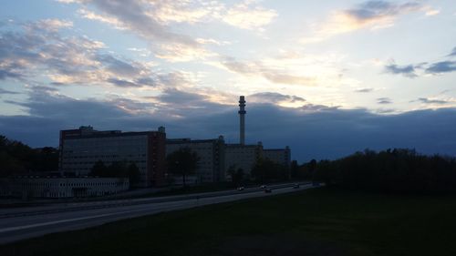 City street against cloudy sky