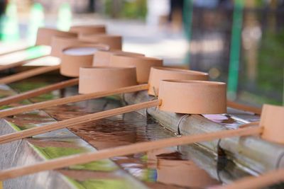 Close-up of chairs on table