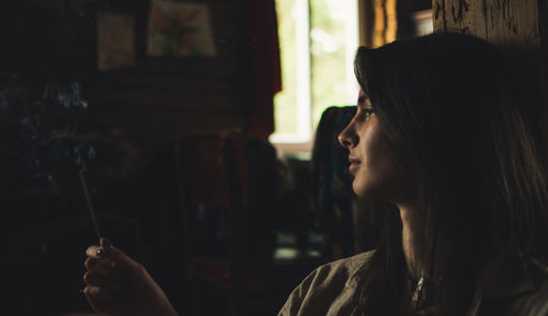 Portrait of young woman looking away