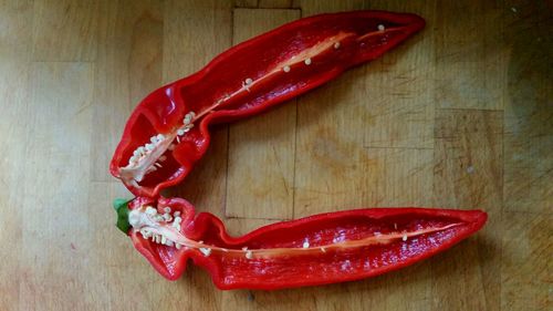 Close-up of red chili peppers on table
