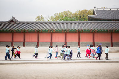 Schoolchildren walking on street