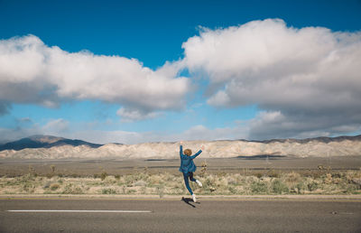 Full length of man against blue sky