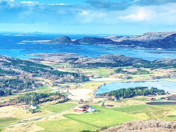 Rain is close. aerial bay with fishing village. distinctive scandinavian scenery with mountain