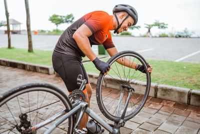 Man riding bicycle on street