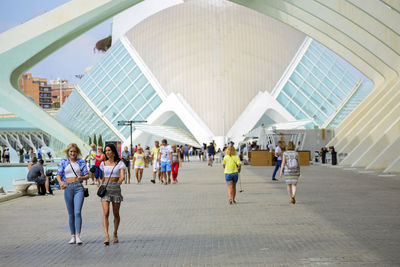 Group of people walking in modern office building