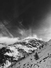 Scenic view of snowcapped mountains against sky