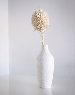 Close-up of white flower vase on table