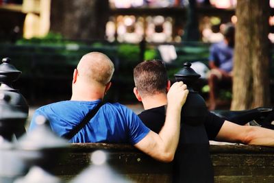 Rear view of man photographing