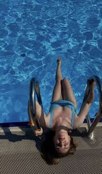 High angle view of woman swimming in pool