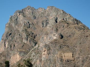 Low angle view of rock formations against sky