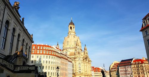 Low angle view of buildings in city against sky