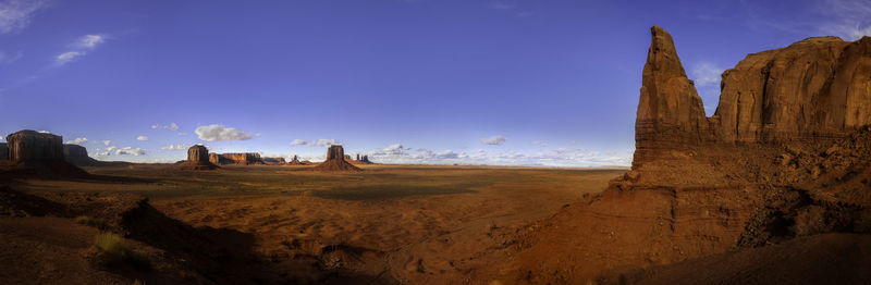 Panoramic view of rock formations against sky