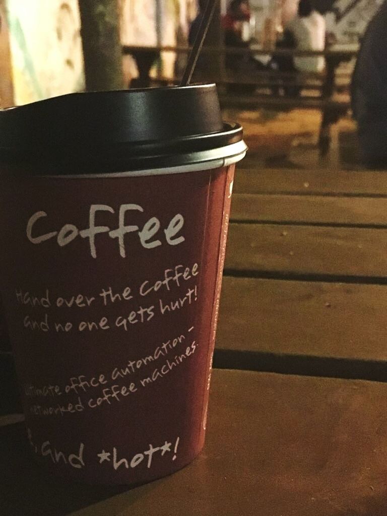 text, western script, coffee cup, coffee - drink, drink, no people, close-up, food and drink, table, indoors, focus on foreground, communication, disposable cup, day, latte, cappuccino, freshness