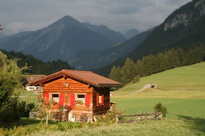 Houses and mountains against sky