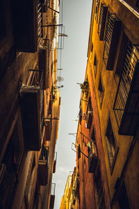 Low angle view of buildings against sky in city