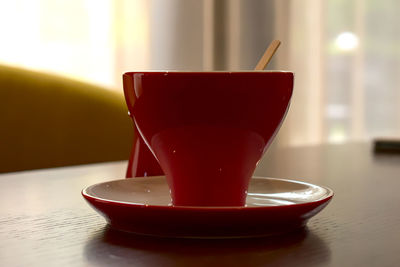 Close-up of coffee cup on table