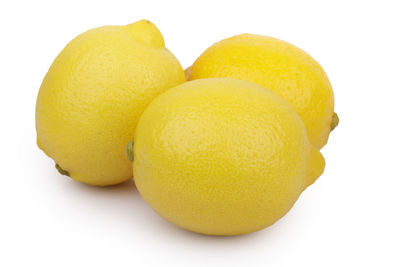 Close-up of oranges against white background