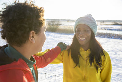 Portrait of smiling young woman at beach