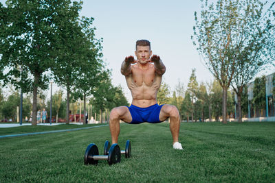 Full length of woman exercising in park