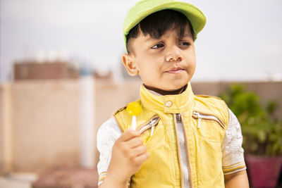 Portrait of cute boy looking away