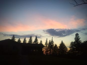 Built structure against sky at sunset