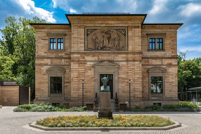 Facade of historic building against sky