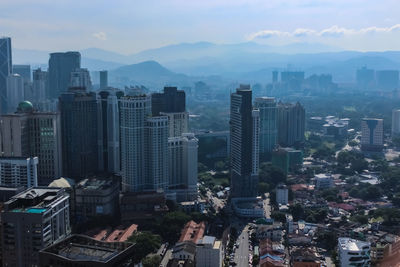 Aerial view of cityscape against sky