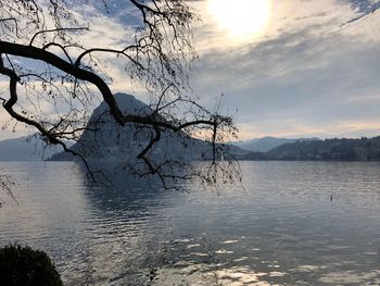 Scenic view of lake against sky during sunset