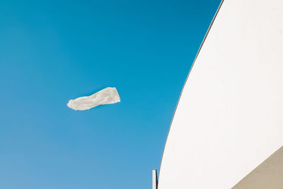 Low angle view of building against clear blue sky