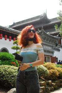 Redheaded woman. picture taken at pairi daiza a famous zoological park in brugelettes in belgium. 