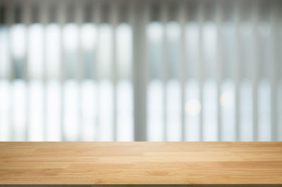 Close-up of wooden table at home